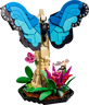 Gros plan du papillon morpho bleu LEGO avec ailes déployées, fleurs roses et magenta, et abeille miniature sur le socle