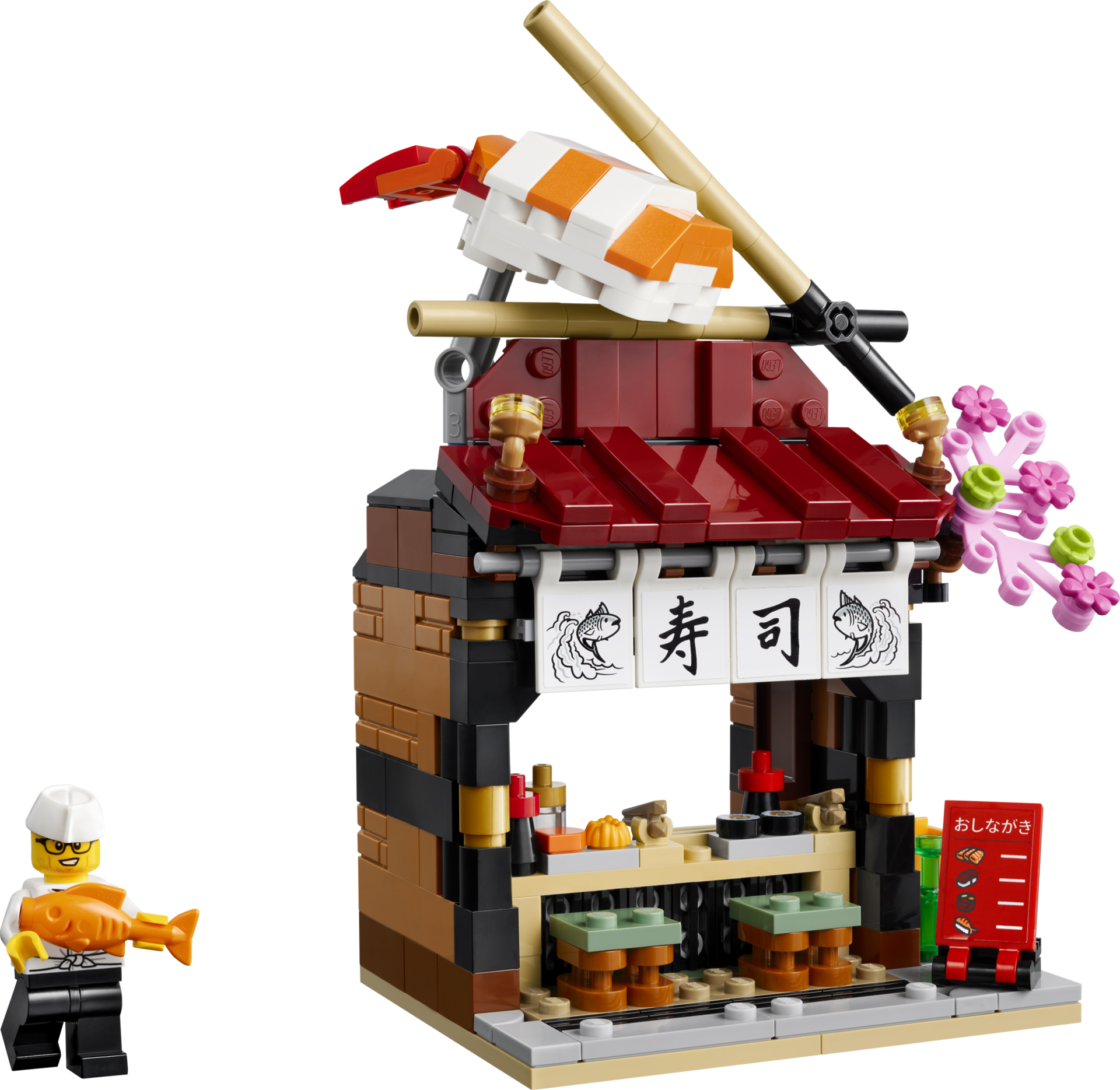 LEGO 40906 Restaurants du monde Japon - Vue de face du restaurant à sushi avec minifigurine de chef tenant un poisson