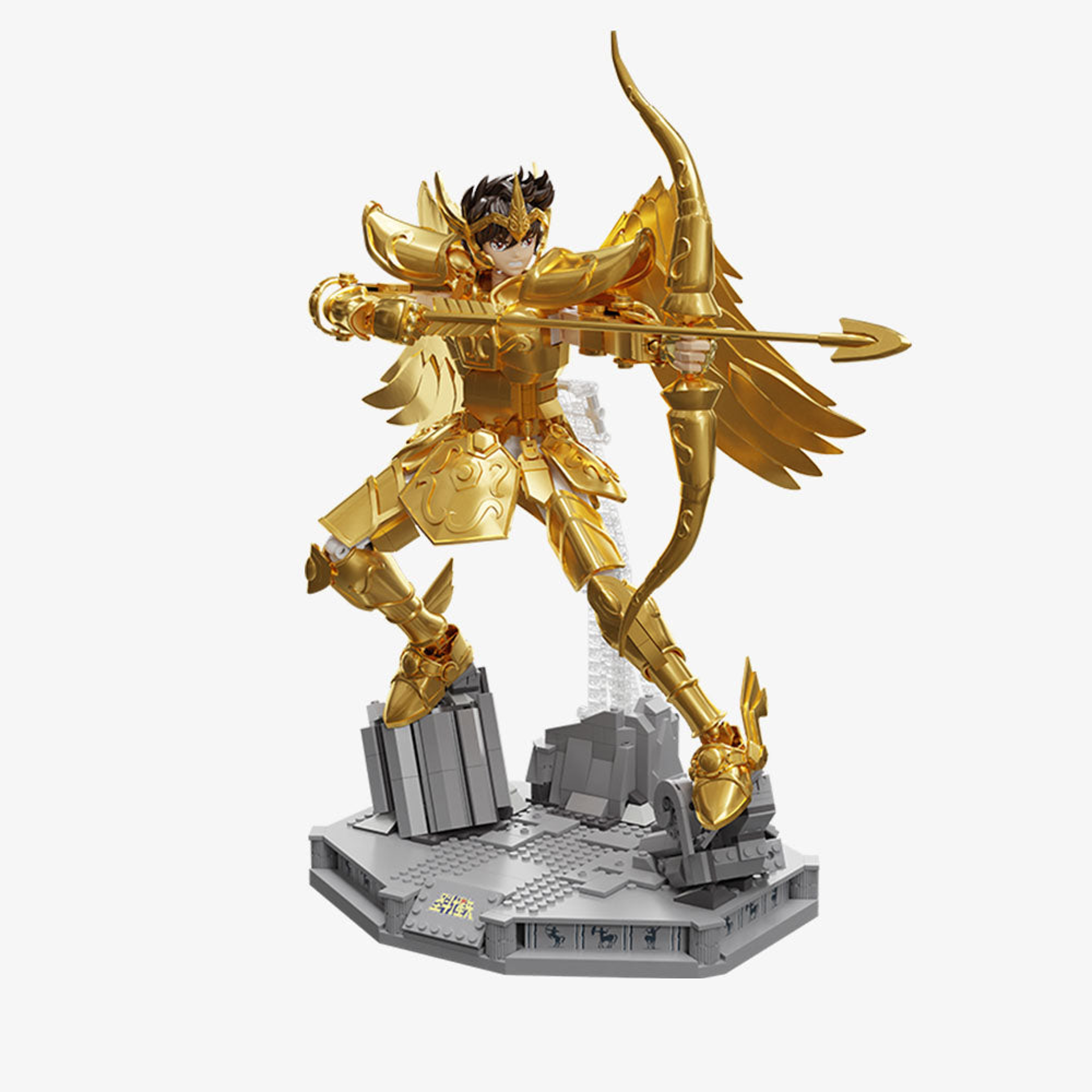 Figurine Saint Seiya Sagittaire en armure dorée avec arc et flèche sur socle en briques gris, vue complète sur fond blanc