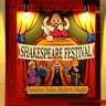 Détail de l'affiche Shakespeare Festival sur la façade avec illustration de personnages et éclairage par spots LED