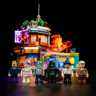 Six minifigurines du set Izakaya F9073 alignées devant le bâtiment illuminé, incluant personnages cyberpunk et chef cuisinier