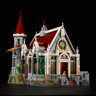 Vue de face du château Lumibricks L9071 sur fond noir avec vitraux illuminés, toit rouge et ailes dorées