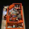 Vue du dessus du rez-de-chaussée de la Brick Art Gallery avec boutique de cadeaux, comptoir et escalier intérieur