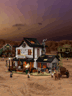 Forge du Far West Lumibricks L9089 éclairée de nuit dans un décor désertique avec bâtiments western en arrière-plan
