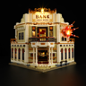 Banque Gold Rock 1868 éclairée par LED sur fond noir avec effet d'explosion lumineux sur la façade