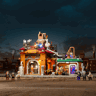 Ore Factory Lumibricks illuminée de nuit avec décor industriel steampunk, minifigurines alignées devant la façade éclairée