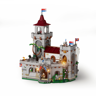 Vue arrière du château médiéval Lumibricks L9119 avec tour principale, toiture rouge, figurines sur les remparts et végétation