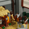 Gros plan sur la figurine du forgeron avec hache devant l'atelier du marché médiéval du set Lumibricks L9119
